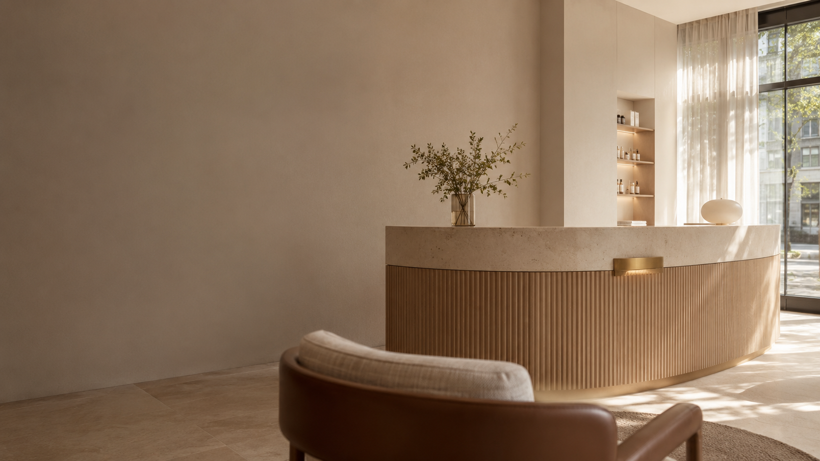 HEMERA reception in Amsterdam — a curved fluted-oak and stone reception desk beneath soft daylight from a sheer-curtained window